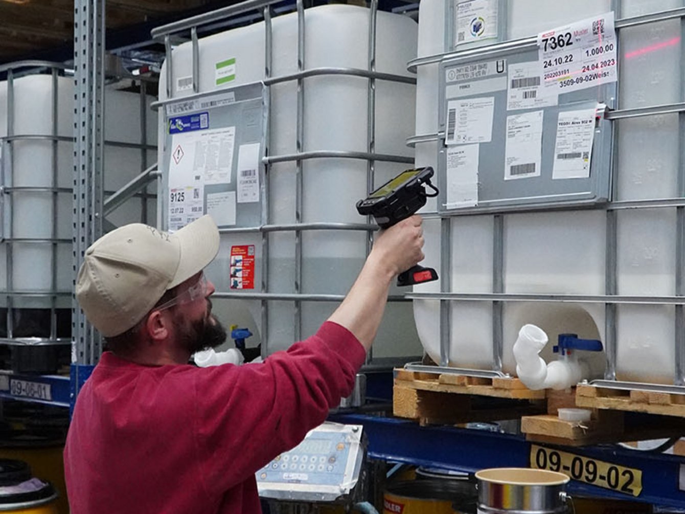 Employee at ADLER Lacke using Trigger Handle