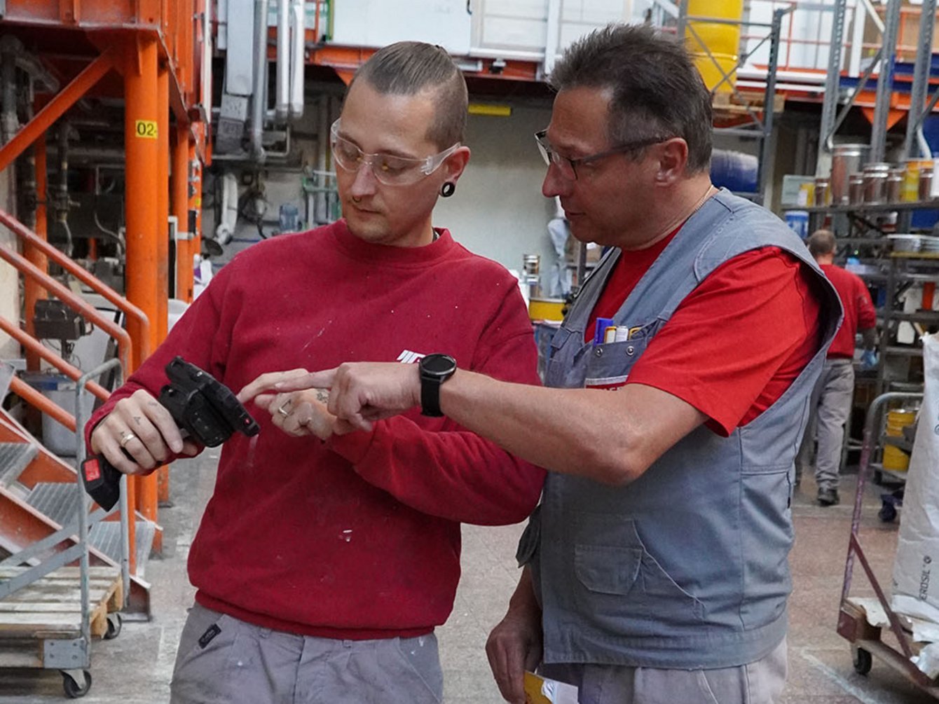 Employee at ADLER Lacke configurating Barcode Scanner by i.safe MOBILE